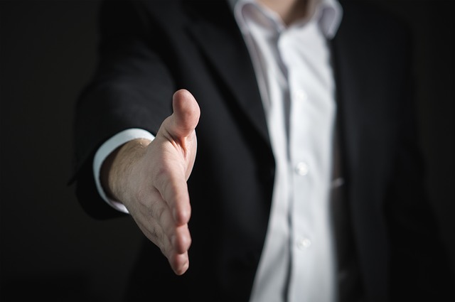 Man holding out his hand for a handshake